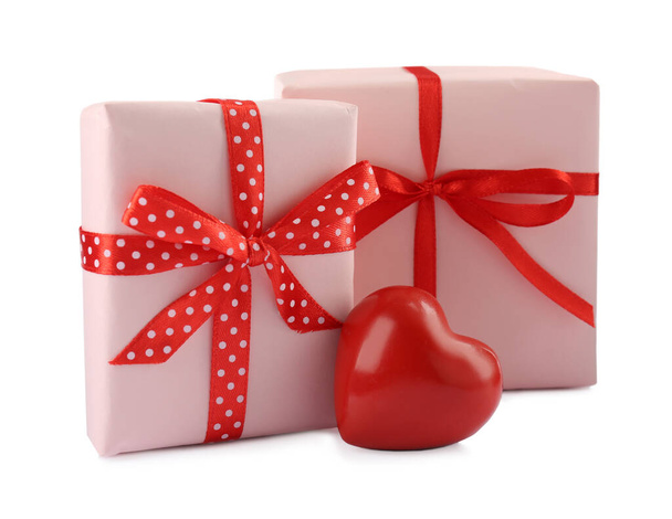 Beautiful gift boxes with decorative red heart isolated on white - Foto, Imagen
