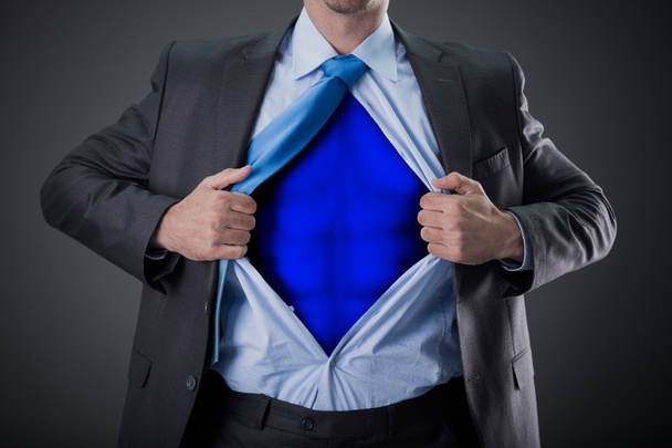 businessman as super hero and tearing his shirt - Photo, image