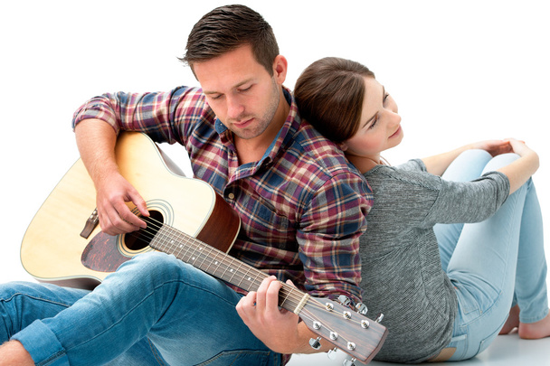 Young couple playing guitar - Φωτογραφία, εικόνα