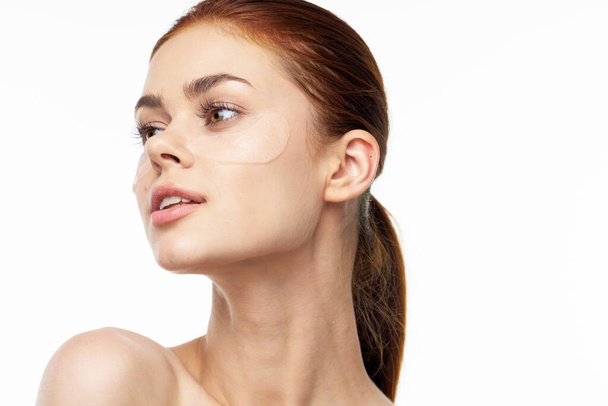 pretty woman in patches on face rejuvenation spa treatments - Valokuva, kuva