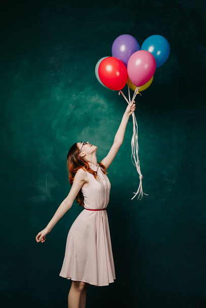 cheerful woman with colorful balloons holiday fun - Photo, image