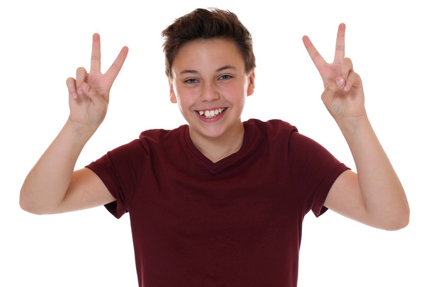 Successful young teenager boy making the victory sign - Fotó, kép