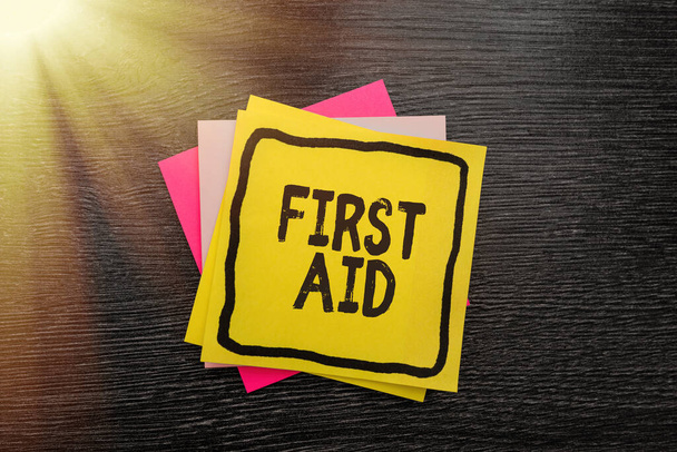 Text sign showing First Aid. Business showcase Practise of healing small cuts that no need for medical training New Ideas Fresh Concept Creative Communications Sticky Note - Photo, Image
