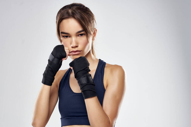beautiful woman hand bandages punch workout fighter isolated background - Photo, Image