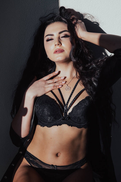 beautiful woman brunette posing in black lingerie - Fotoğraf, Görsel