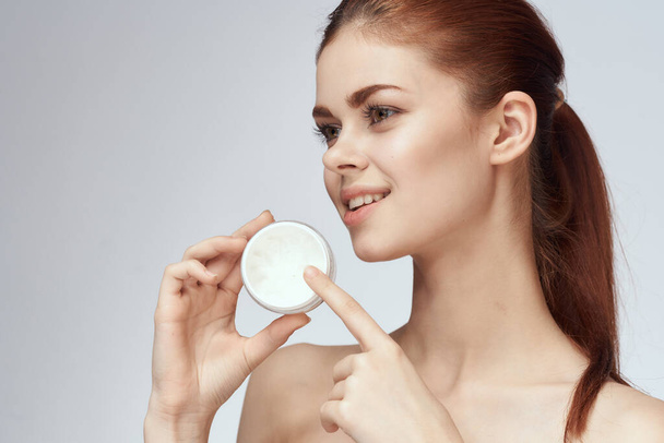 woman with jar of cream makeup face skin care close-up - Фото, изображение