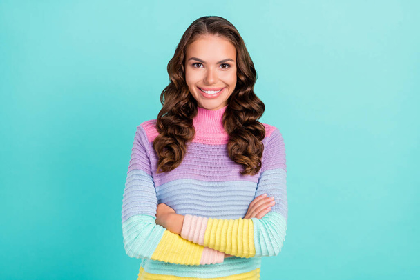 Photo of optimistic brunette young lady crossed arms wear striped pullover isolated on teal color background - Fotografie, Obrázek