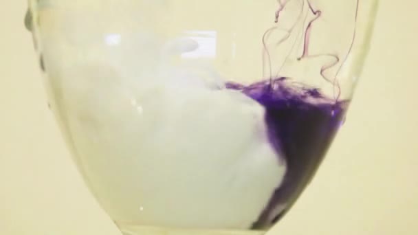 Color Dyes Being Added Into Wine Glass -  Purple And White - Metraje, vídeo
