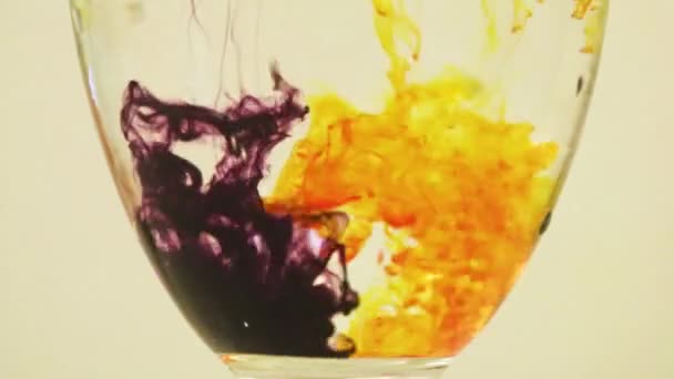 Color Dyes Being Added Into Wine Glass - Yellow And Blueberry - Metraje, vídeo
