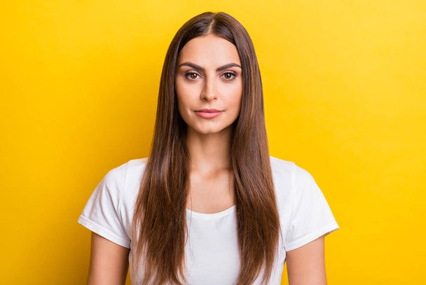 Photo portrait young woman brown hair smiling wearing white t-shirt isolated vivid yellow color background - Zdjęcie, obraz