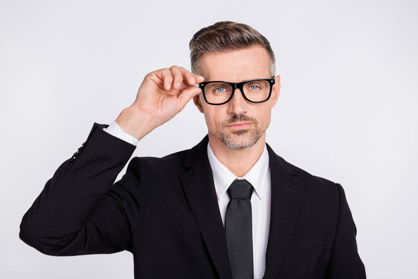 Photo of serious smart mature clerk dressed black suit arm glasses isolated grey color background - Fotó, kép
