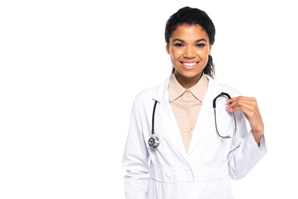 Young african american doctor smiling at camera isolated on white - Φωτογραφία, εικόνα