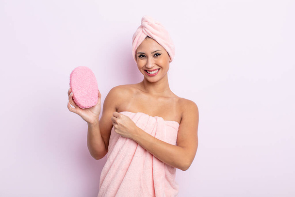 asiatic pretty woman feeling happy and facing a challenge or celebrating. bathrobe and sponge concept - Fotó, kép