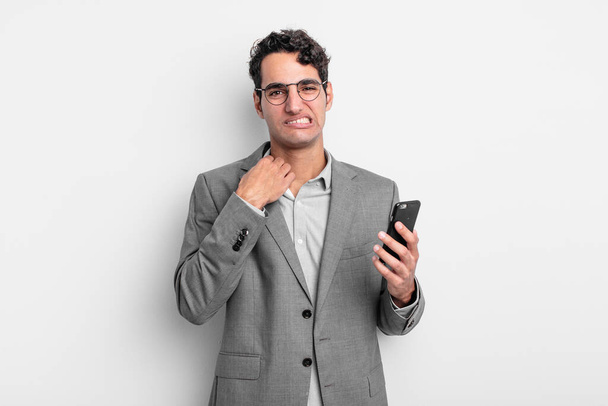 hispanic handsome man feeling stressed, anxious, tired and frustrated. business and phone concept - Foto, Imagen
