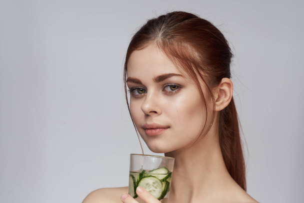 woman with cucumber drink health vitamins close-up - Foto, Imagem
