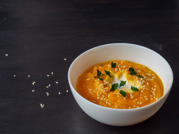 pumpkin puree soup with parsley and sesame seeds - Photo, Image