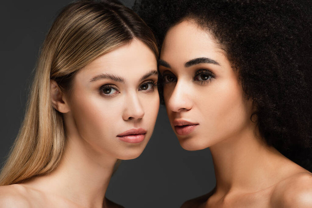 pretty interracial women with clean skin and natural makeup isolated on grey - Photo, Image