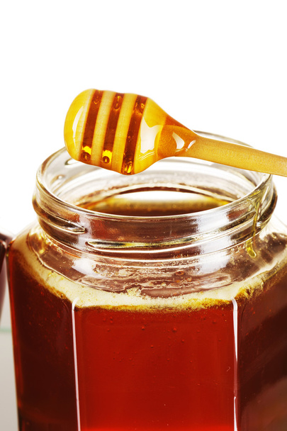 Jar of honey and dipper - Foto, immagini