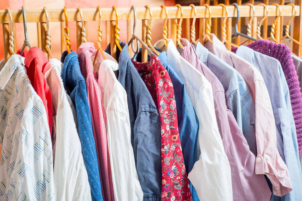 Lot of different clothes on hangers. Copy space - Foto, Imagem