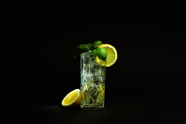 long drink glass with ice an clear liquid - Fotoğraf, Görsel