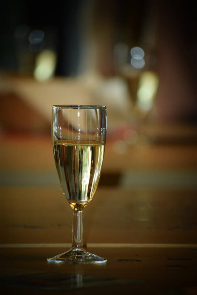 A flipped vertical shot of a glass of champagne - Φωτογραφία, εικόνα
