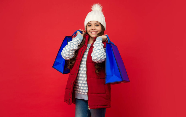 black friday discount. seasonal christmas sales. cheerful teen girl in with shopping bag. - 写真・画像