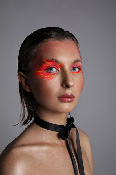 Headshot of young woman with bright eyeshadow make-up. Vertical and isolated. - Foto, Imagem