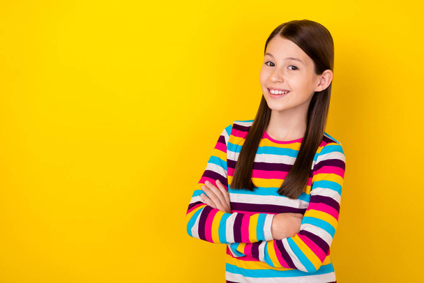 Photo of self-assured small lady crossed hands beaming smile wear striped shirt isolated yellow color background - Fotoğraf, Görsel