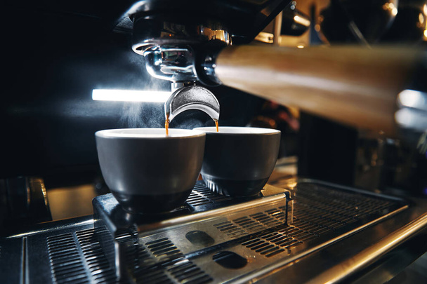 Horizontal photo of espresso machine working with bar interior background - Foto, afbeelding