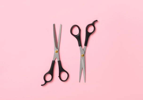 Scissors of hairdresser on color background, top view - Photo, Image