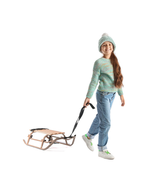 Little girl with sled on white background - Photo, Image