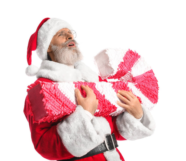 Santa Claus con piñata de bastón de caramelo aislado en blanco - Foto, Imagen