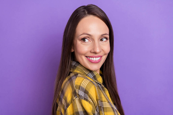 Profile photo of beaming mature lady look empty space wear plaid shirt isolated on purple color background - Fotó, kép