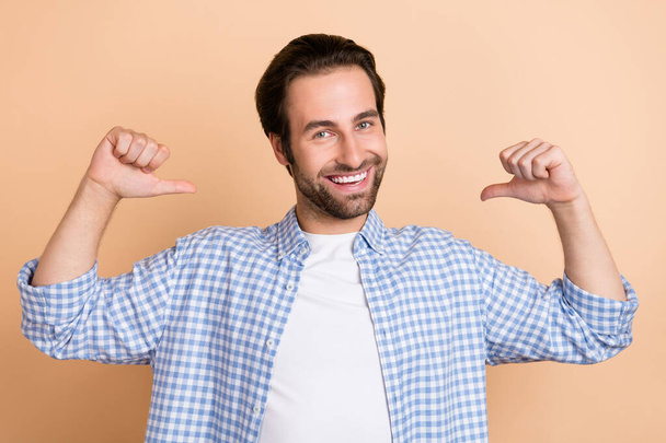 Photo of cute millennial guy index himself wear plaid shirt isolated on beige color background - Φωτογραφία, εικόνα