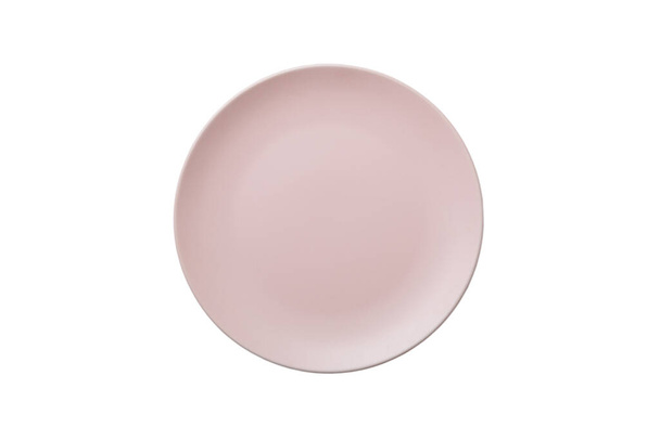 Placa redonda de cerámica rosa aislada sobre fondo blanco. Vista superior. - Foto, imagen