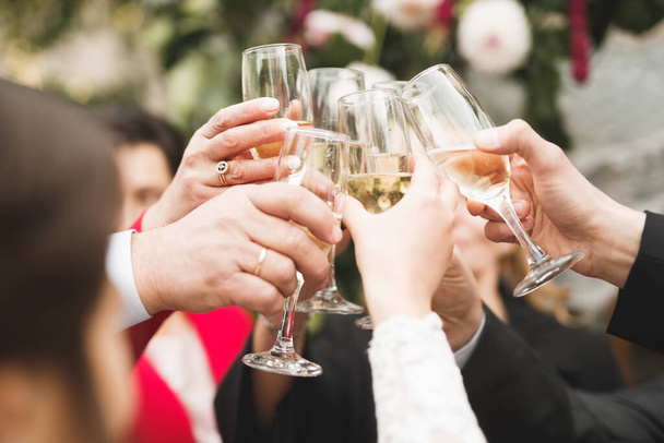Bride and a groom with the glasses of champagne. - 写真・画像