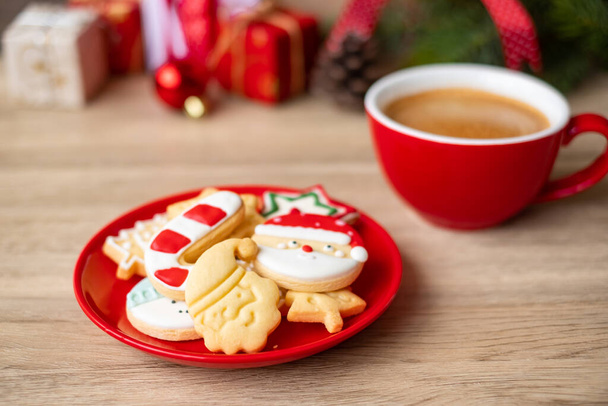 Merry Christmas with homemade cookies and coffee cup on wood table background. Xmas eve, party, holiday and happy New Year concept - Photo, Image