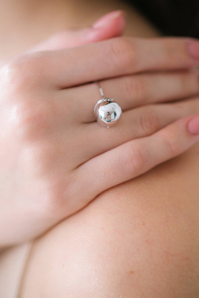 Trendy silver ring on a beautiful young girl. Beauty and fashion  - Valokuva, kuva