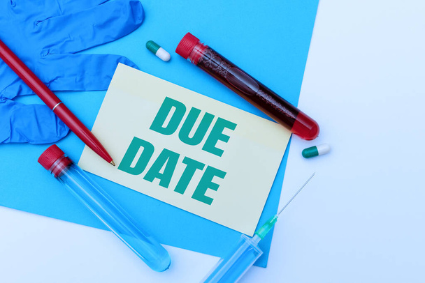 Writing displaying text Due Date. Internet Concept The date when payment should be received by the person or company Presenting Infection Medicine, Gathering Medical Informations - Photo, Image