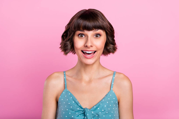 Portrait of attractive cheerful amazed girl good news reaction isolated over pink pastel color background - Foto, imagen