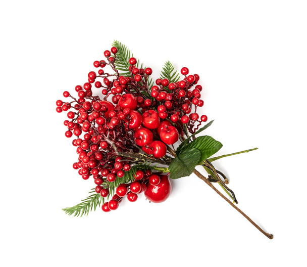 Christmas branch with red berries. Artificial home decoration plant, rowan, ashberry or kalina twig isolated on white background - Photo, Image