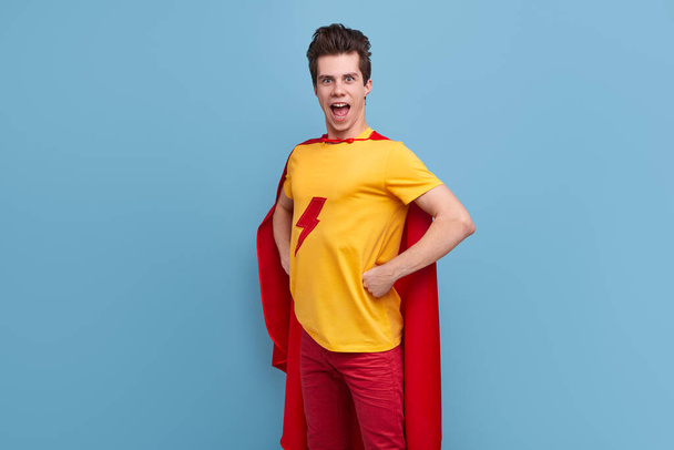 Brave male superhero in costume in studio - Photo, Image