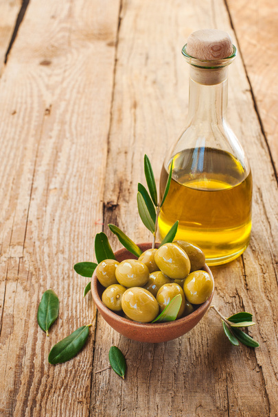 Olives on rustic table in a bowl - Foto, imagen