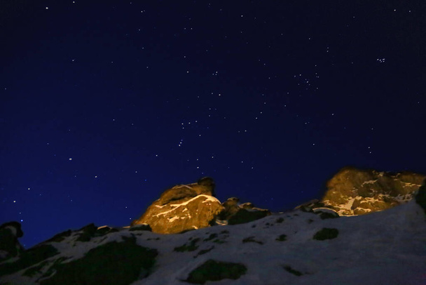The beautiful view of the night sky above the mountain peaks. - Photo, Image