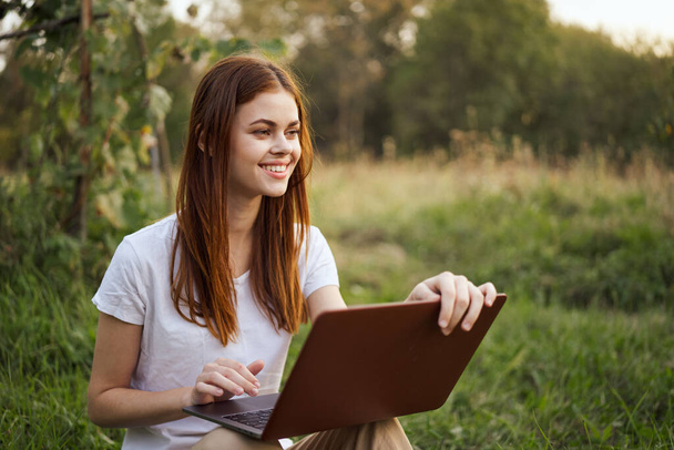 cheerful woman outdoors laptops communication internet recreation - Foto, imagen