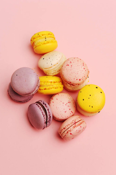 French dessert colorful macarons, pink background - 写真・画像