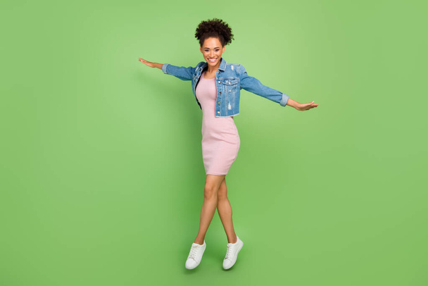 Full length photo of cool young lady jump wear dress shirt sneakers isolated on green background - Fotografie, Obrázek