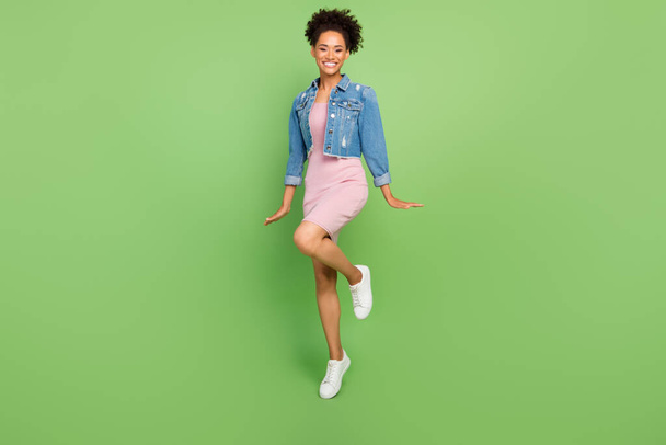 Full body photo of cool young lady dance wear dress shirt sneakers isolated on green background - Foto, immagini