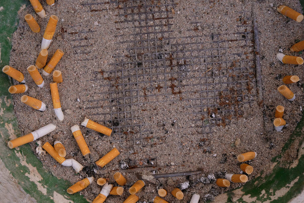 Saulheim, Rhineland-Palatinate, Germany. July 31, 2021. Cigarette butts and ashes of Marlboro cigarettes. Selective focus. Copy space. - Photo, Image
