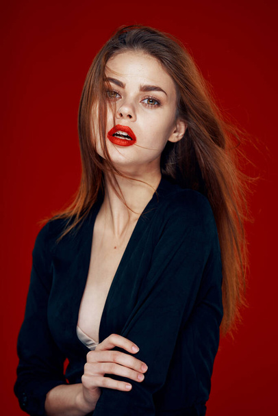 pretty woman with red lips red hair Glamor posing red background - 写真・画像